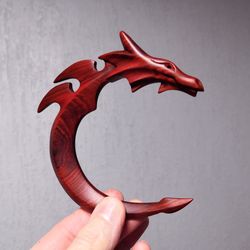 red dragon hair clip. curved wooden hair stick in the shape of a dragon.