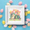 1 Cute Easter bunny in the spring green garden with red yellow pink tulips and multicolored Easter eggs and flowers cross stitch PDF pattern created for Creativ