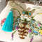 porcelain blue eye bee with floral wings beaded purse.jpg