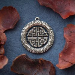 Celtic knot ornament pendant on leather cord. Scandinavian jewelry. Pagan protective Mascot. Handcrafted necklace.
