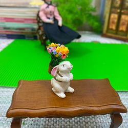 Easter miniature. Bunny with a basket of flowers. 1:12