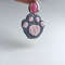 Crochet_Cat_Paw_on_a_White_Background_with_a_Pink_Keychain_3.jpg