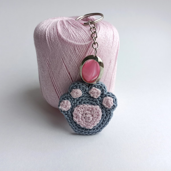 Crochet_Cat_Paw_on_a_White_Background_with_a_Pink_Keychain_7.jpg