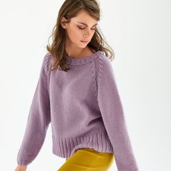Classic oversized pullover sweater with a smooth structure and a pattern on the ragged lines of the sleeves, a seamless