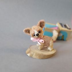Chihuahua is a soft doll dog. miniature knitted puppy. A dog figurine as a gift for the holiday