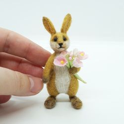 Miniature needle felted rabbit with flowers in his paws