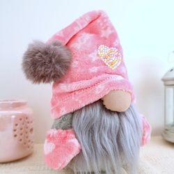 pink gnome stuffed doll with heart