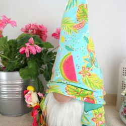 Bright summer gnome with flowers