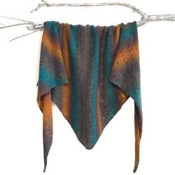 shawl  woolen knitted. bactus. sunrise on the beach