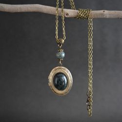 Moss agate locket necklace. Dark green gemstone medallion. Bronze oval locket in vintage style. Witchy jewelry gift.