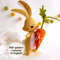 Felt Easter sand color bunny with long ears and bright orange carrot in his hand.jpg