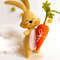 Felt Easter sand color bunny with long ears and bright orange carrot in his hand.jpg