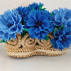 Cornflowers in a straw basket