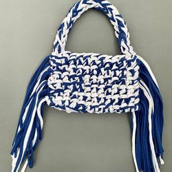 crocheted baguette bag with metal clasp and long fringe