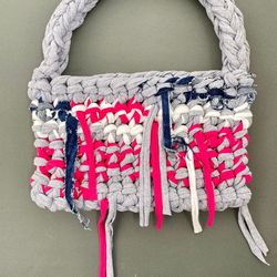 crocheted baguette bag with metal button clasp
