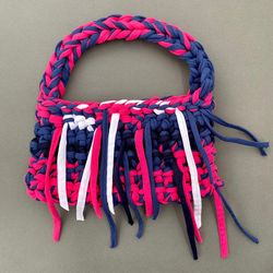 crocheted baguette bag with metal button clasp