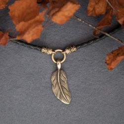 Feather pendant on leather cord with raven heads. Bird Pagan jewelry in scandinavian style. Present for her. Asatru