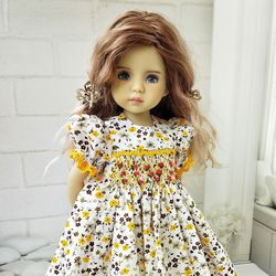 Little Darling floral print smocked dress with yellow trim.