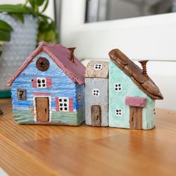 a set of cute miniature handmade houses, tiny wooden houses, an original eco-gift in a nautical style, driftwood, sea