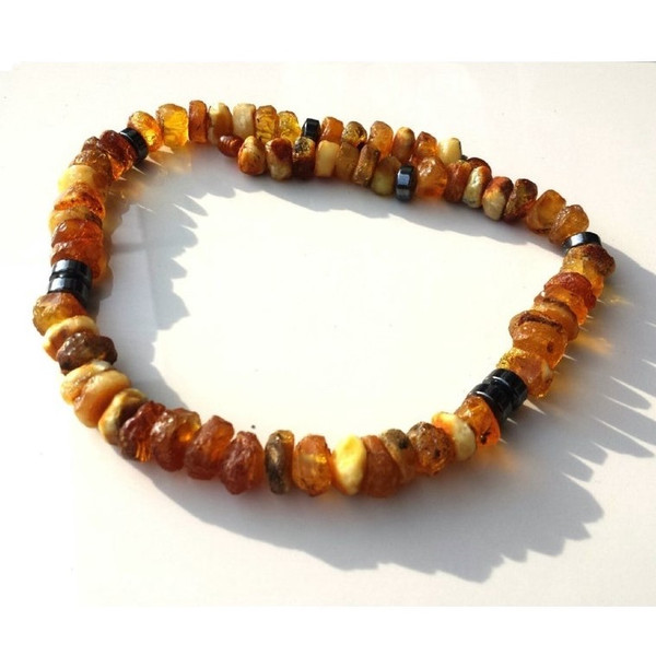 Raw Baltic Amber Necklace helps in the treatment of the thyroid gland, stomach,.jpg