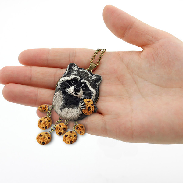 Raccoon with cookies polymer clay tutorial Cabochon for Jewelry.jpg