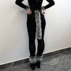 Wolf tail made of faux fur for a party, festival, cosplay, masquerade. Gray-black fluffy tail for fancy dress.