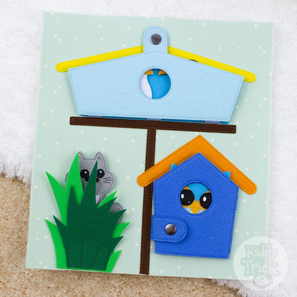 felt book page with birdhouses