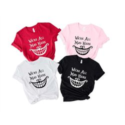 we're all mad here shirt, alice in wonderland shirt, cheshire cat shirt, disney shirt, mad hatter shirt, disney cheshire