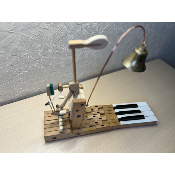 Table bell made of an old piano and an antique bell | Inspire Uplift