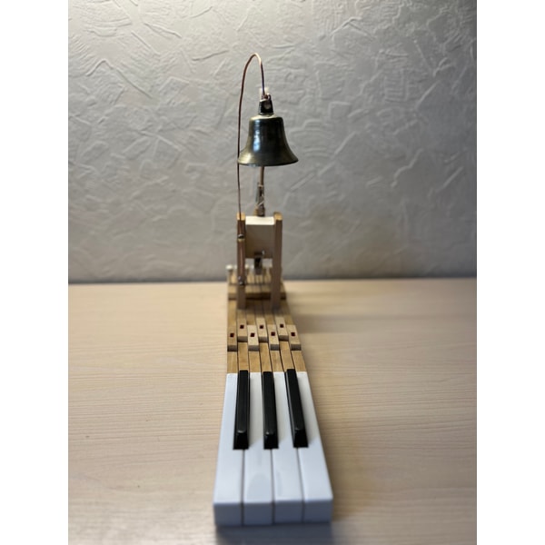 Table bell made of an old piano and an antique bell | Inspire Uplift