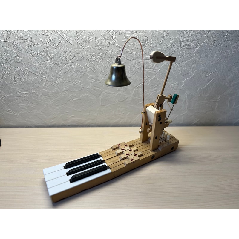 Table bell made of an old piano and an antique bell | Inspire Uplift