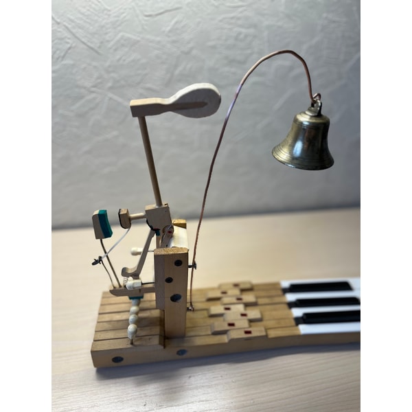 Table bell made of an old piano and an antique bell | Inspire Uplift