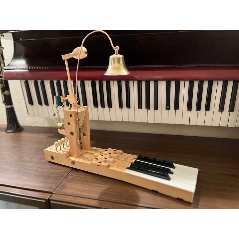 Table bell made of an old piano and an antique bell | Inspire Uplift