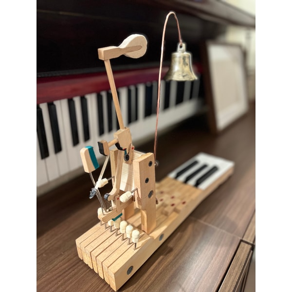 Table bell made of an old piano and an antique bell | Inspire Uplift