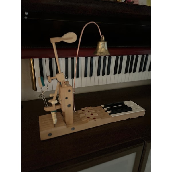 Table bell made of an old piano and an antique bell | Inspire Uplift