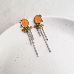 Long orange earrings with chains and glass beads, metal and enamel jewelry
