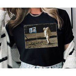 retro man on the moon i love disney logo flag graphic shirt / astronaut in space t-shirt / outer space tee / disney birt