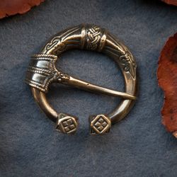 Handcrafted brooch with viking ornament. replica from ancient times. Pagan Scandinavian jewelry. outerwear accessory