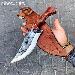custom handmade carbon steel bushcraft hunting knife with wood handle and leather sheath.