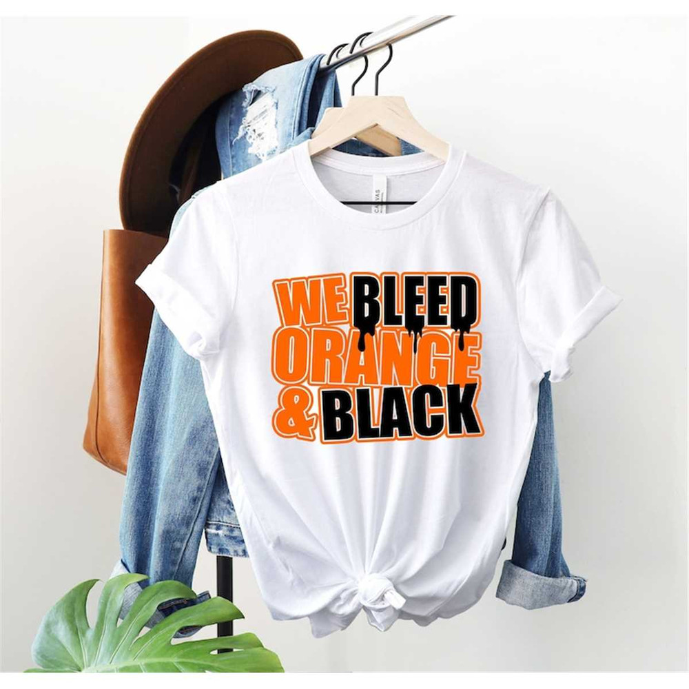 MR-85202316337-we-bleed-orange-and-black-shirt-school-pride-shirt-orange-image-1.jpg