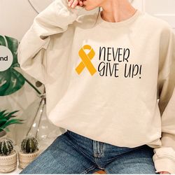 cancer fighter crewneck sweatshirt, childhood cancer hoodies and sweaters, gold cancer ribbon long sleeve shirt, cancer