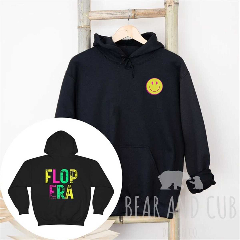 MR-95202316512-flop-era-smiley-face-unisex-hooded-sweatshirt-in-my-flop-era-black.jpg