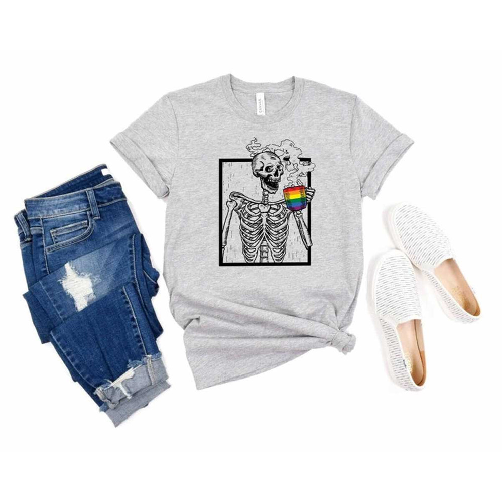 MR-105202321647-skeleton-drinking-coffee-rainbow-flag-shirt-lgbtq-pride-image-1.jpg