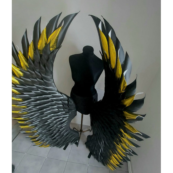 Standing black wings wall decor backdrop.jpeg
