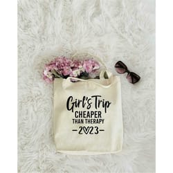 girl's trip cheaper than theraphy 2023 tote bag, book bag, road trip tote bag, shopping tote bag, weekend trip tote bag,