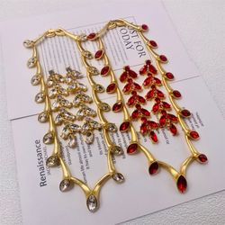 Elegant medieval style jewelry in the form of leaves decorated with zirconia stones