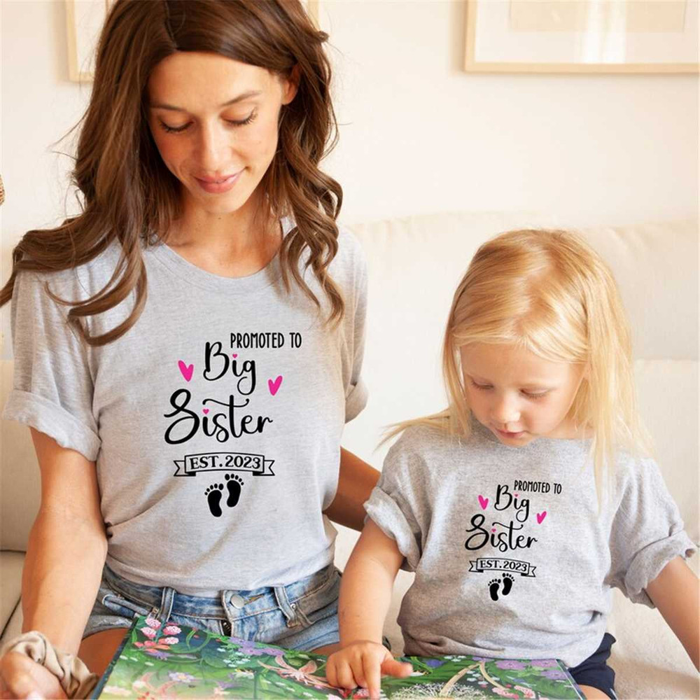 MR-1652023165317-promoted-to-big-sister-shirt-est-2022-or-2023-baby-image-1.jpg