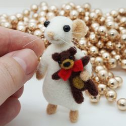 Miniature needle felted mouse with a tiny brown teddy bear toy