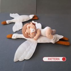 Baby doll and goose hugging sleep pillow for a fairytale nursery sewing pattern out of felt