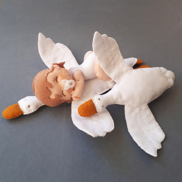 Baby doll and goose hugging sleep pillow fairytale nursery sewing pattern.jpg